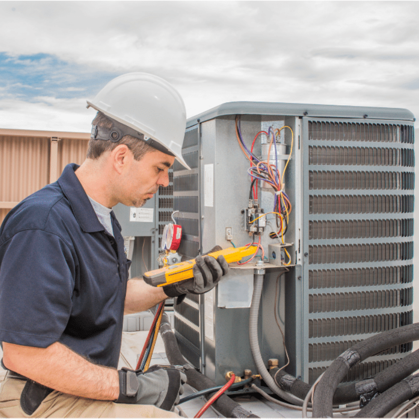 Aurora HVAC Pros HVAC technician servicing a system