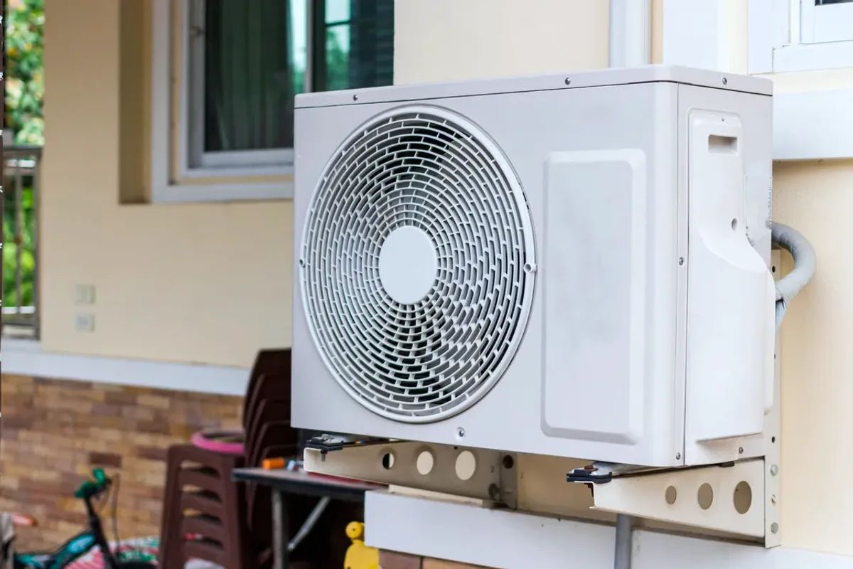 Outdoor heat pump unit on a wall bracket